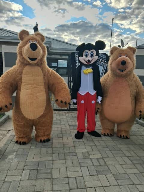 Three character mascot costumes ready to add fun to a celebration