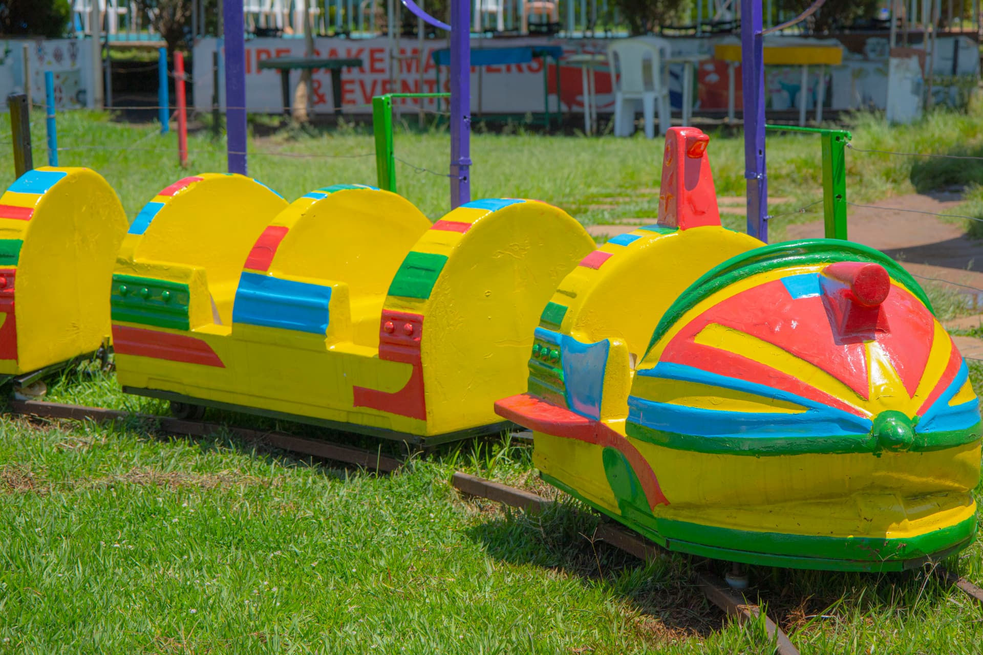 The brightly painted baby train carriages on their track at Vipe Fun Park