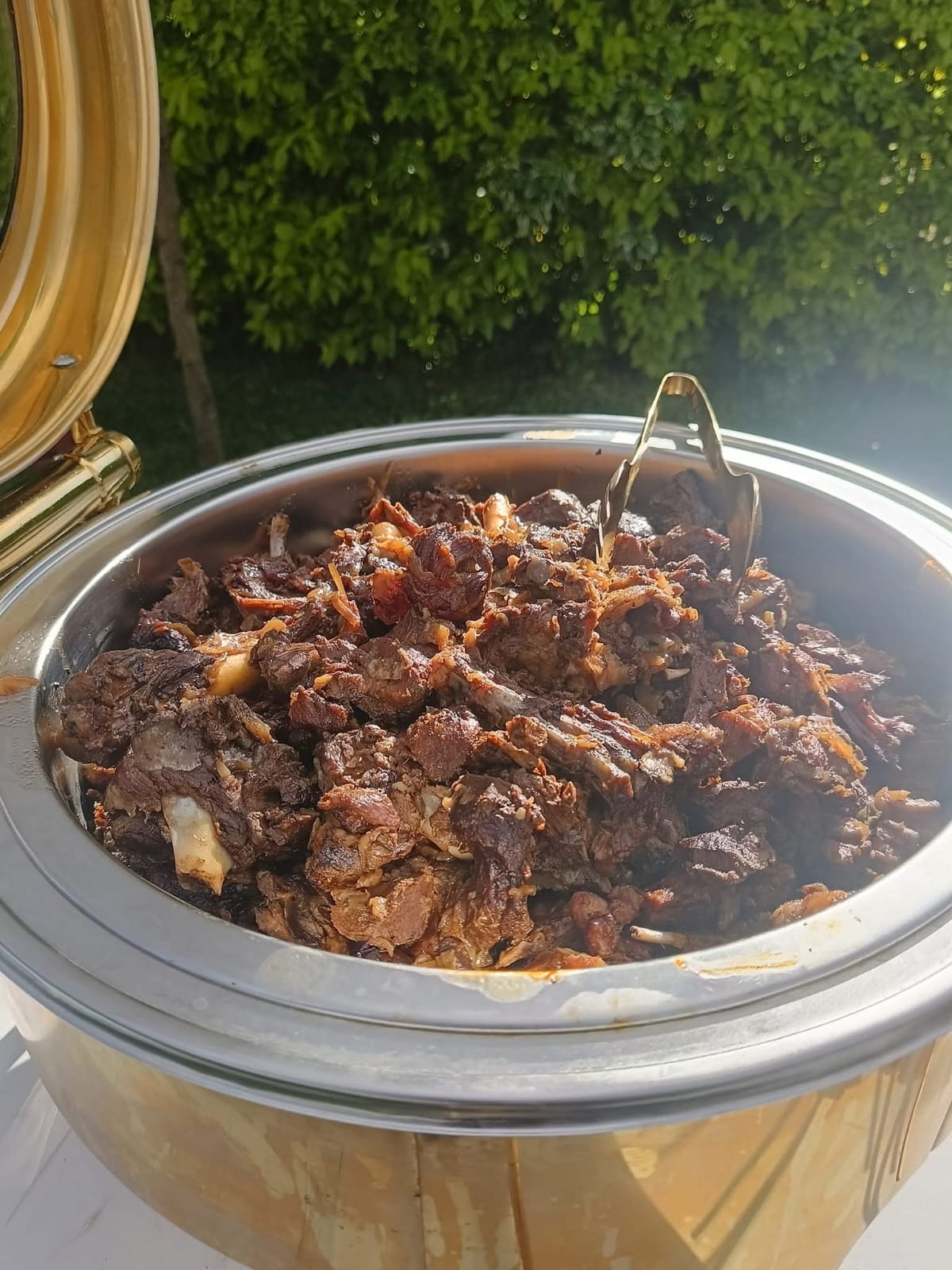 Slow-cooked beef served in a warming dish outdoors at Vipe Fun Park
