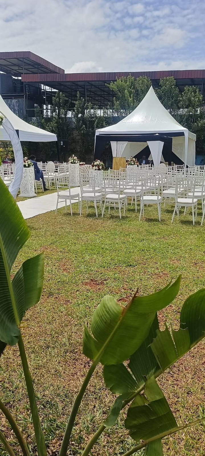 Rows of white chairs and a marquee tent set up for an outdoor celebration at Vipe Fun Park