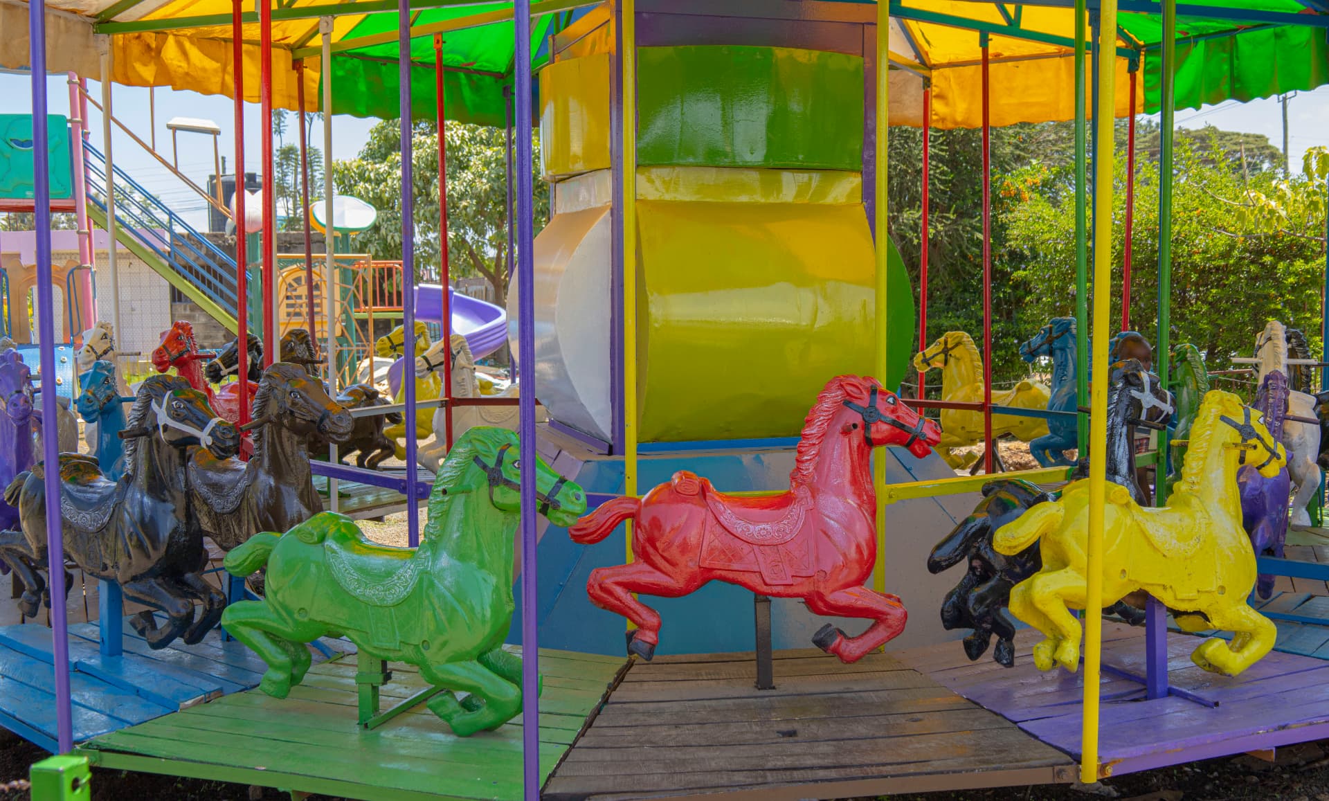 The colourful horse carousel at Vipe Fun Park under a bright sky