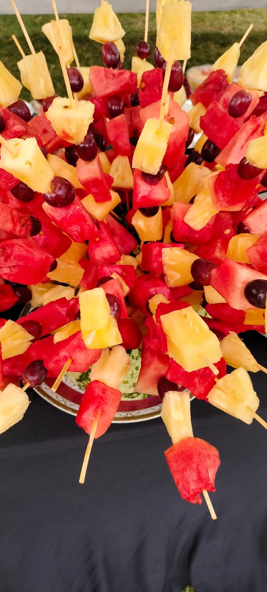 Watermelon, pineapple and grape skewers arranged on a serving tray at Vipe Fun Park