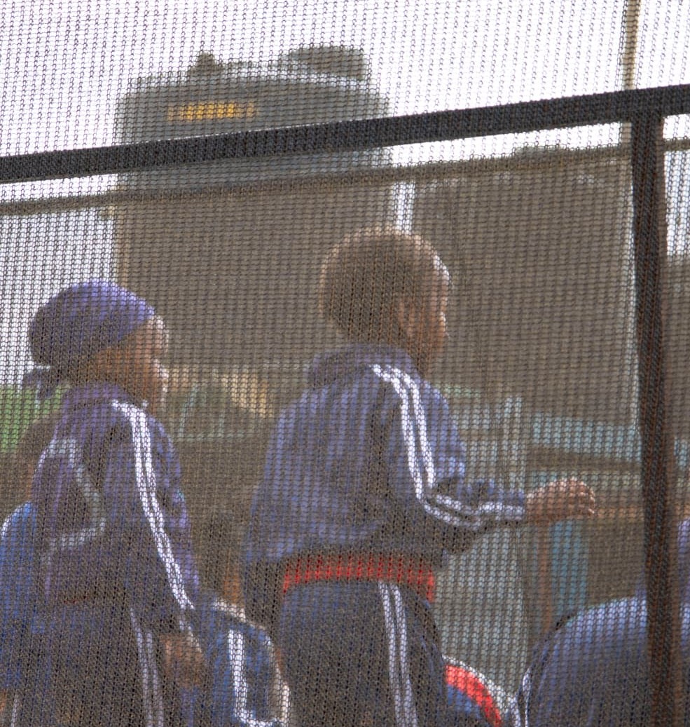 Children enjoying a trampoline behind its protective netting at Vipe Fun Park