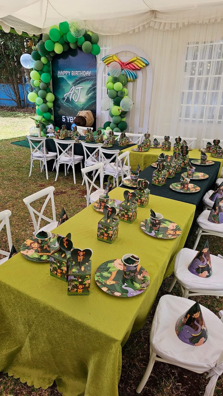 A jungle-themed birthday party with balloon columns, gift boxes and set tables at Vipe Fun Park