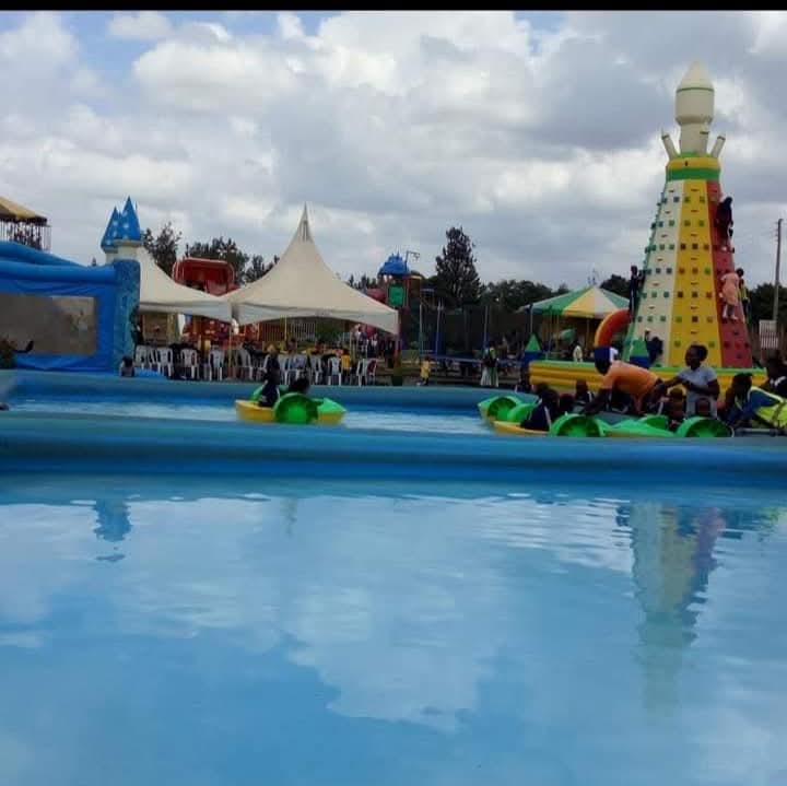 Visitors using paddle boats in the water park pool at Vipe Fun Park